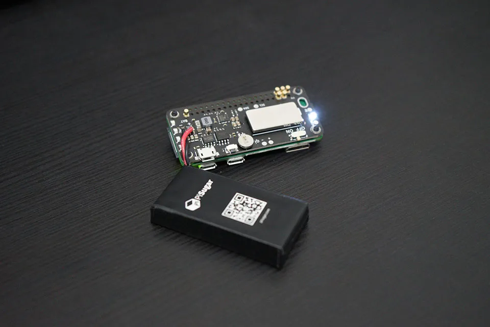 Original PiSugar module mounted beneath a Raspberry Pi board with an attached battery